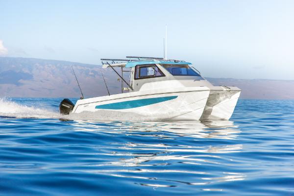 Slide: The Image of 2023 Aquila 28 Molokai Cuddy cruising on open water. - 0