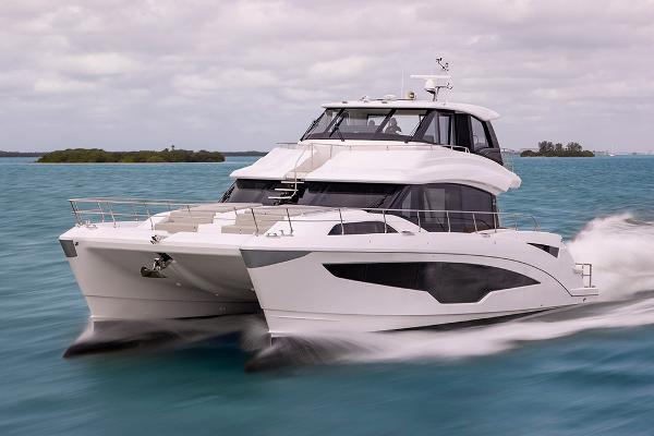 Slide: The Image of 2023 Aquila 70 Luxury yacht cruising on the ocean. - 1