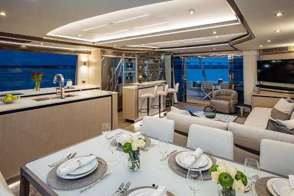 Slide: The Image of 2023 Aquila 70 Luxury yacht interior with modern kitchen and dining area. - 19