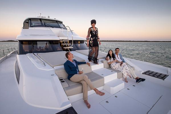 Slide: The Image of People enjoying sunset on 2023 Aquila 70 Luxury yacht. - 9