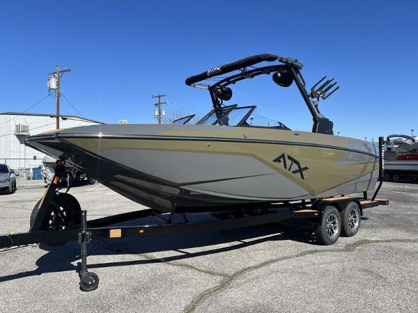 Slide: The Image of 2024 ATX Surf Boats 24 Type-S on trailer in parking lot. - 1
