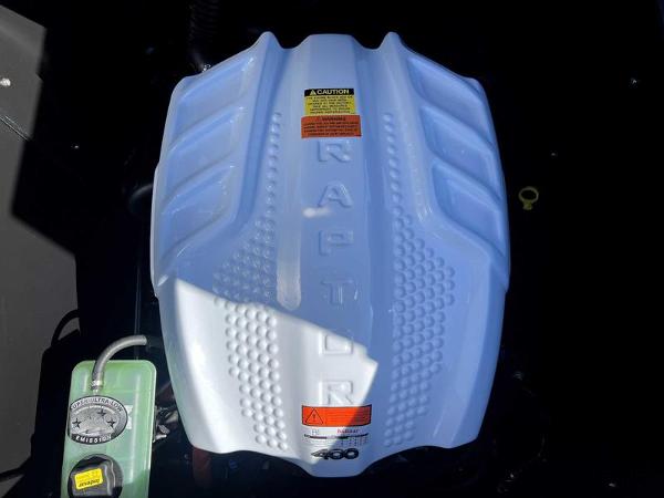 Slide: The Image of 2024 ATX Surf Boats 24 Type-S engine with Raptor branding. - 13