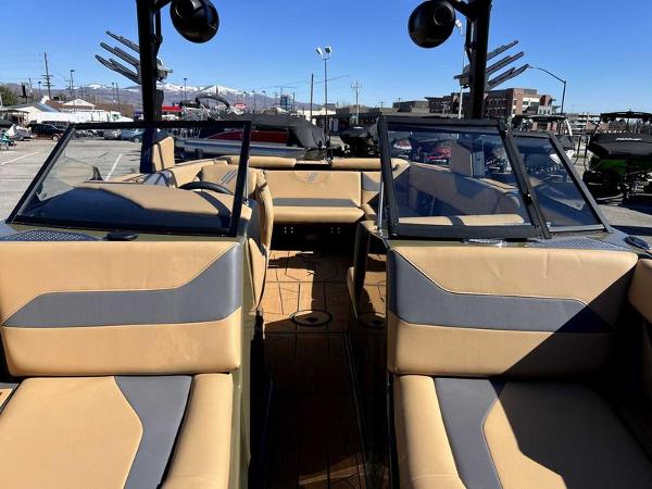 Slide: The Image of 2024 ATX Surf Boats 24 Type-S interior with tan and gray seating. - 8