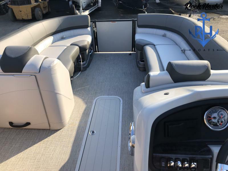 Slide: The Image of 2023 Avalon 2585 Catalina Entertainer boat interior with luxurious seating and modern dashboard. - 11