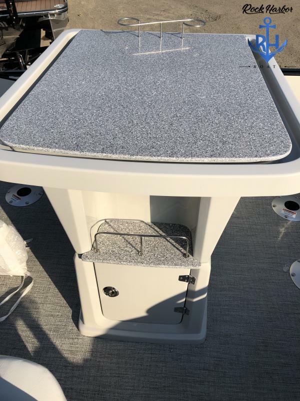 Slide: The Image of 2023 Avalon 2585 Catalina Entertainer boat with a granite-style countertop and storage cabinet. - 13
