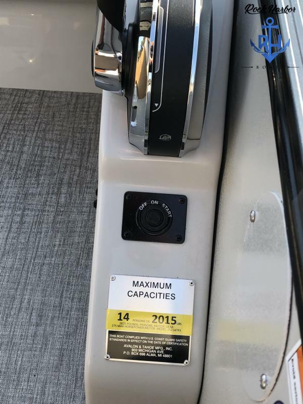 Slide: The Image of 2023 Avalon 2585 Catalina Entertainer boat control panel with maximum capacity label. - 15