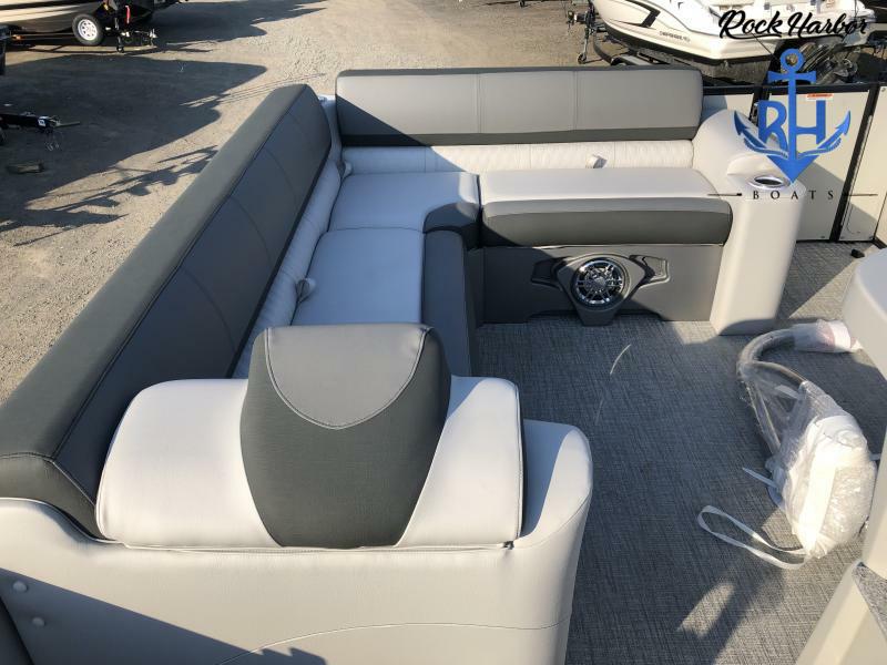 Slide: The Image of 2023 Avalon 2585 Catalina Entertainer boat interior with gray and white seating. - 17