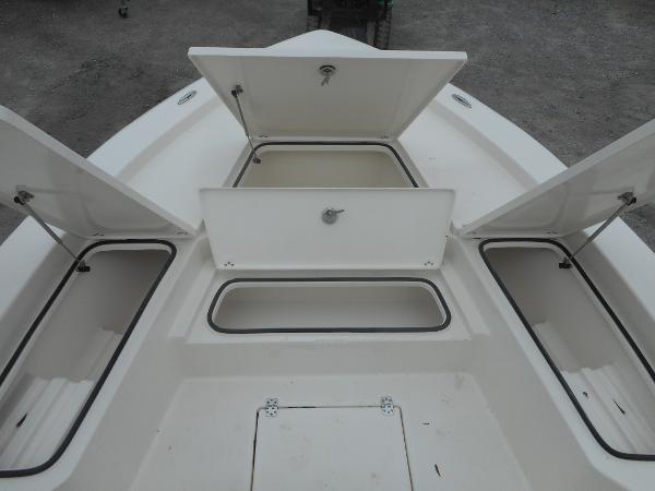 Slide: The Image of 2024 Avenger 26 Avenger boat with open storage compartments - 12