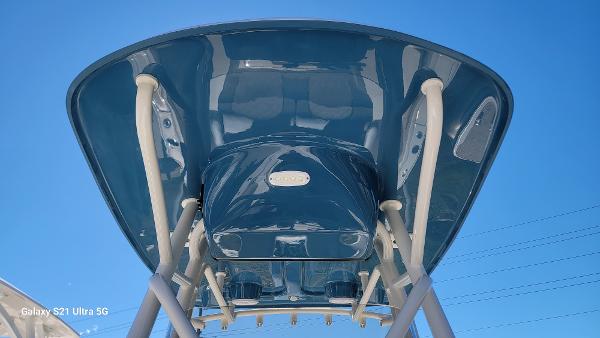 Slide: The Image of 2024 Avenger AV26 boat top view under clear blue sky. - 10