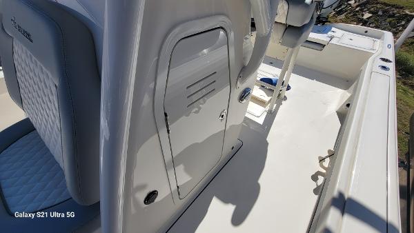 Slide: The Image of 2024 Avenger AV26 boat interior with storage compartment and seating. - 11