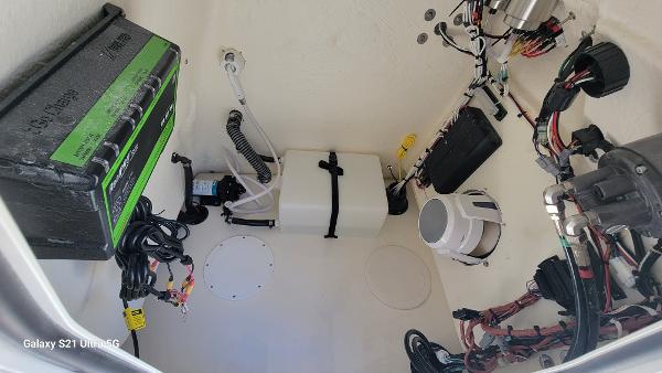 Slide: The Image of 2024 Avenger AV26 boat electrical compartment with battery and wiring - 12