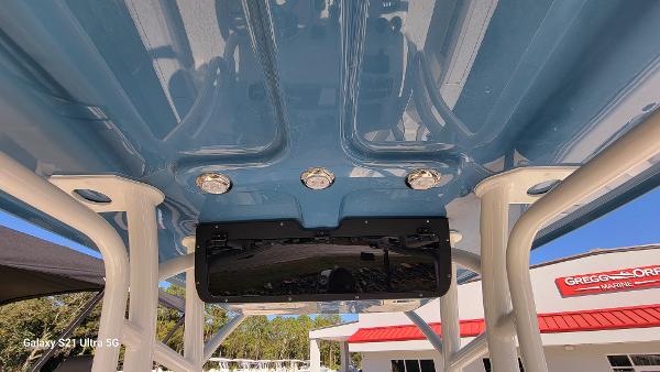 Slide: The Image of 2024 Avenger AV26 boat T-top with integrated lights and electronics. - 14