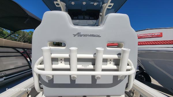 Slide: The Image of 2024 Avenger AV26 boat seat with rod holders and logo. - 18