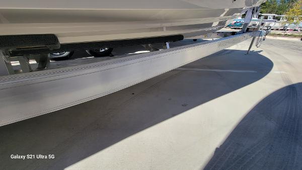 Slide: The Image of 2024 Avenger AV26 boat trailer close-up on a sunny day. - 27