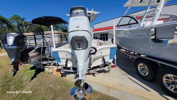 Slide: The Image of 2024 Avenger AV26 boat with powerful outboard motor on display. - 4