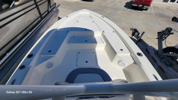 Slide: The Image of 2024 Avenger AV26 boat deck with storage compartments and seating. - 6