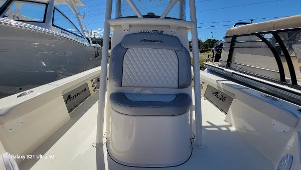 Slide: The Image of 2024 Avenger AV26 boat interior with cushioned seating and sleek design. - 9