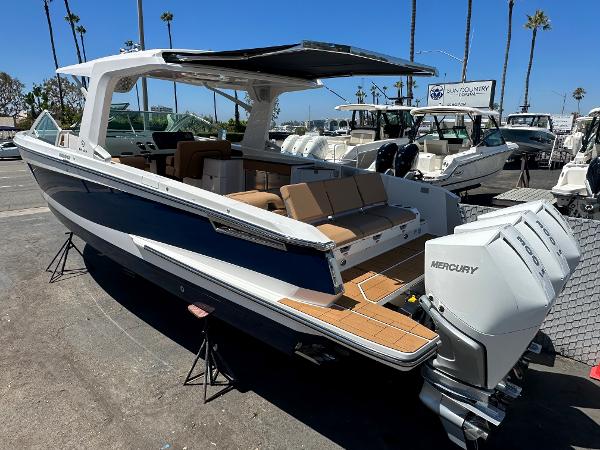 Slide: The Image of 2024 Aviara AV36 luxury boat with triple Mercury outboard engines. - 13