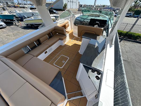 Slide: The Image of 2024 Aviara AV36 boat interior with tan seating and modern amenities. - 3