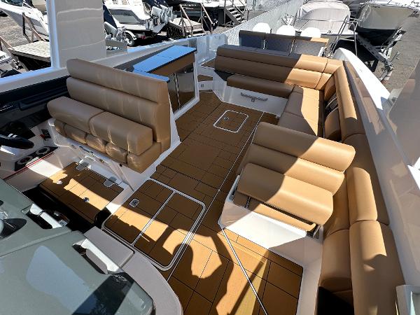 Slide: The Image of 2024 Aviara AV36 boat interior with tan leather seating and spacious deck. - 8