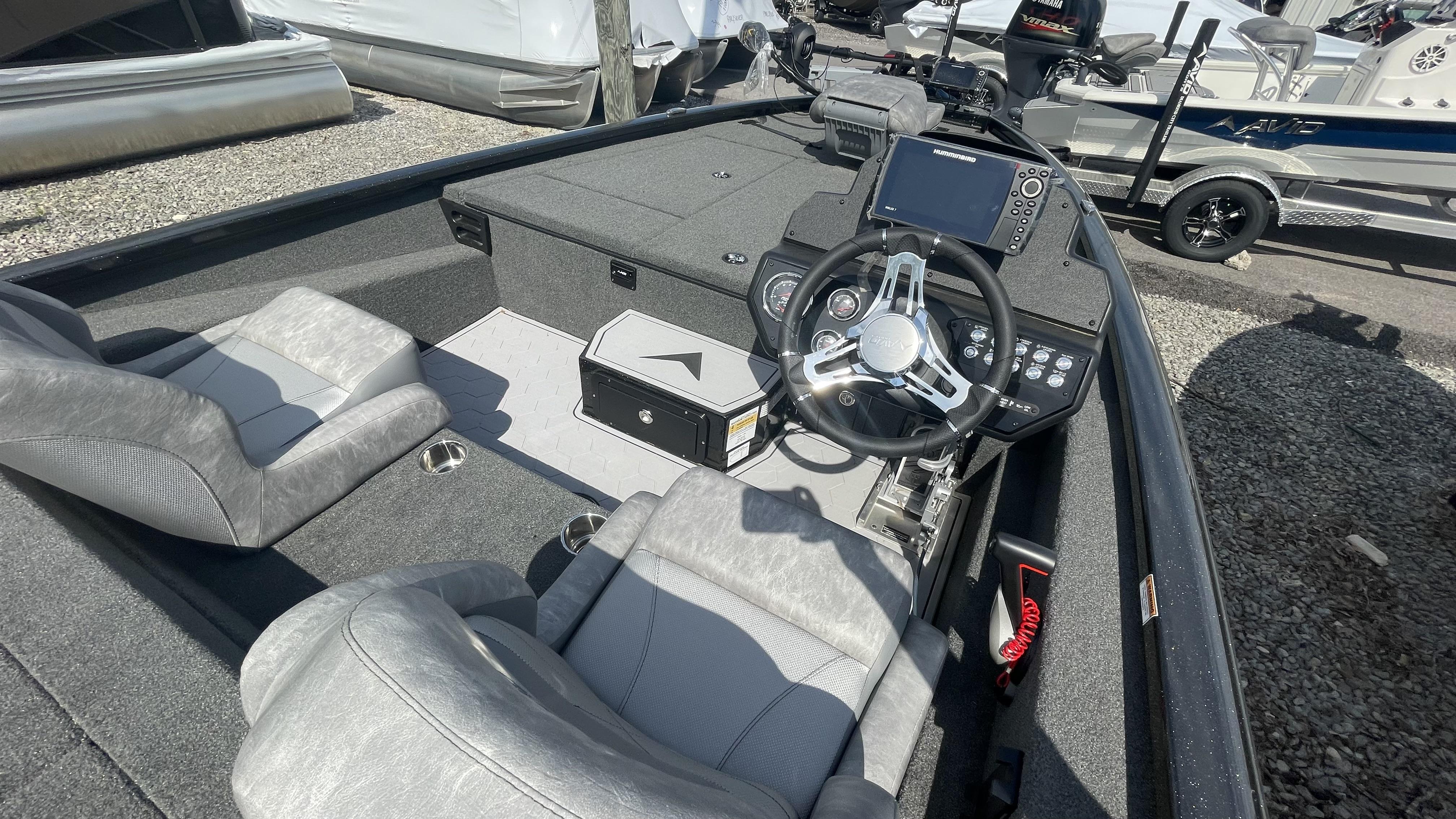 Slide: The Image of 2023 Avid 19XB boat interior with steering wheel and seating. - 17