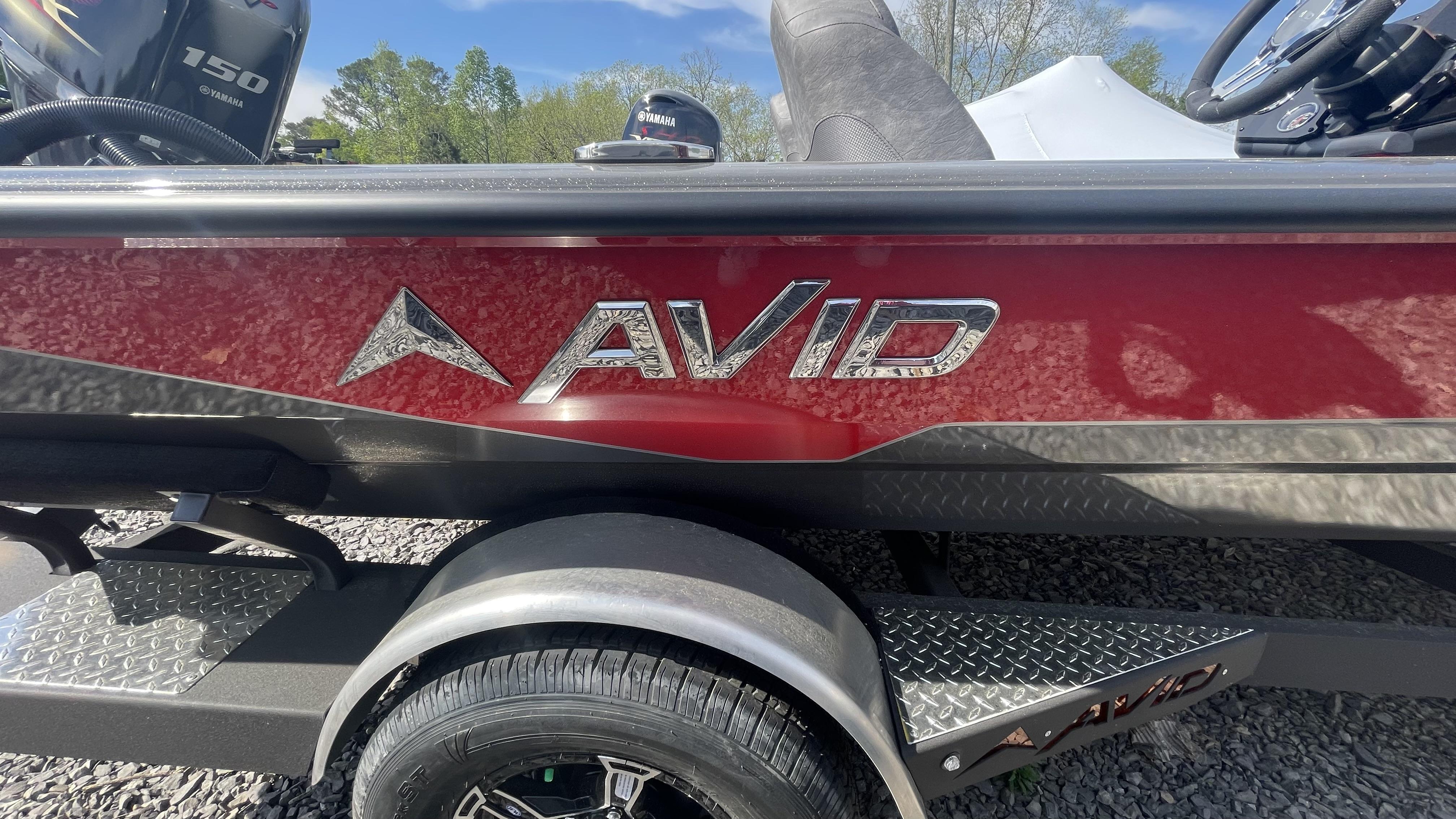 Slide: The Image of 2023 Avid 19XB boat with Yamaha 150 engine, red and black design. - 2