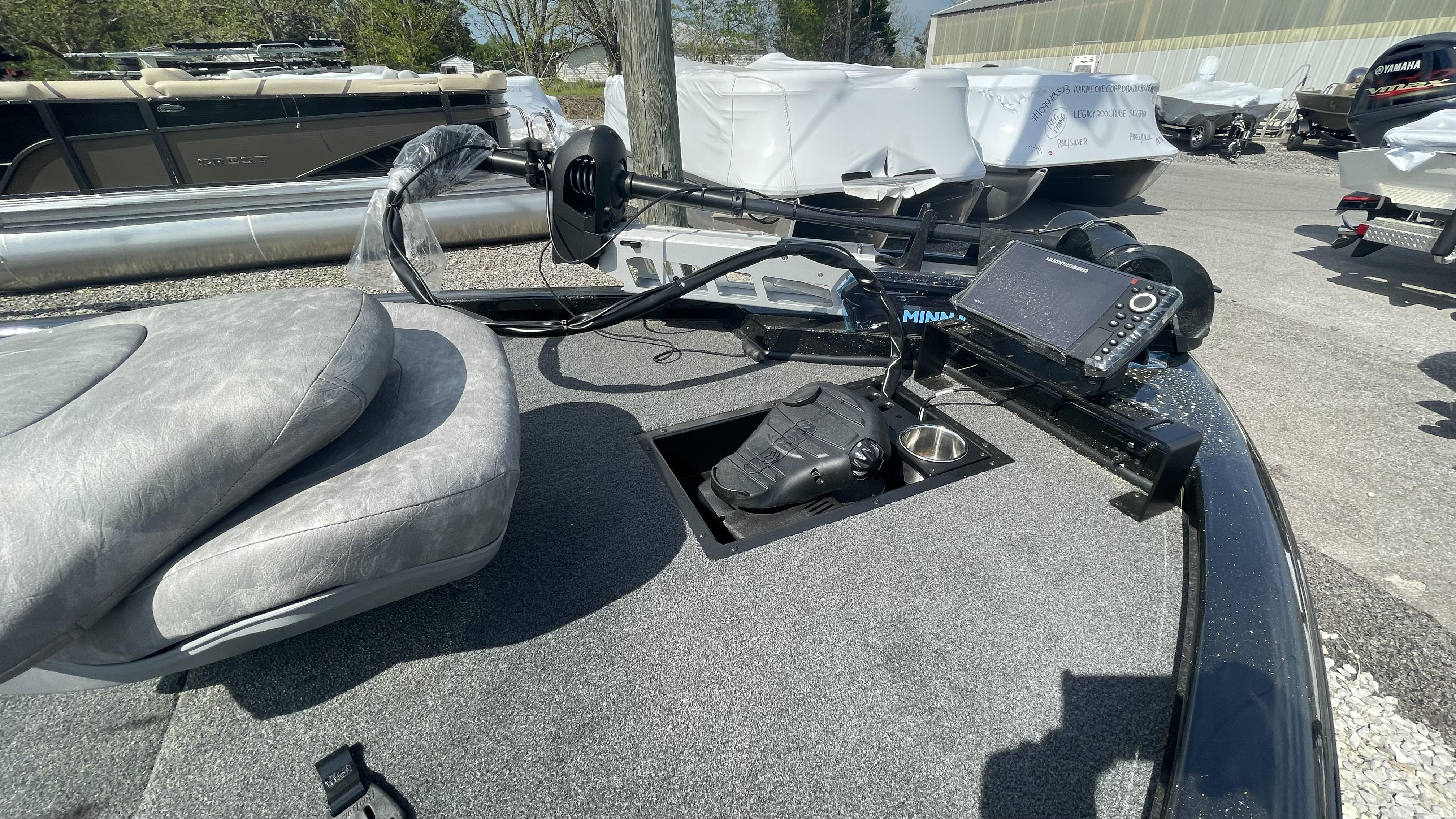Slide: The Image of 2023 Avid 19XB boat with Minn Kota trolling motor and fish finder. - 3