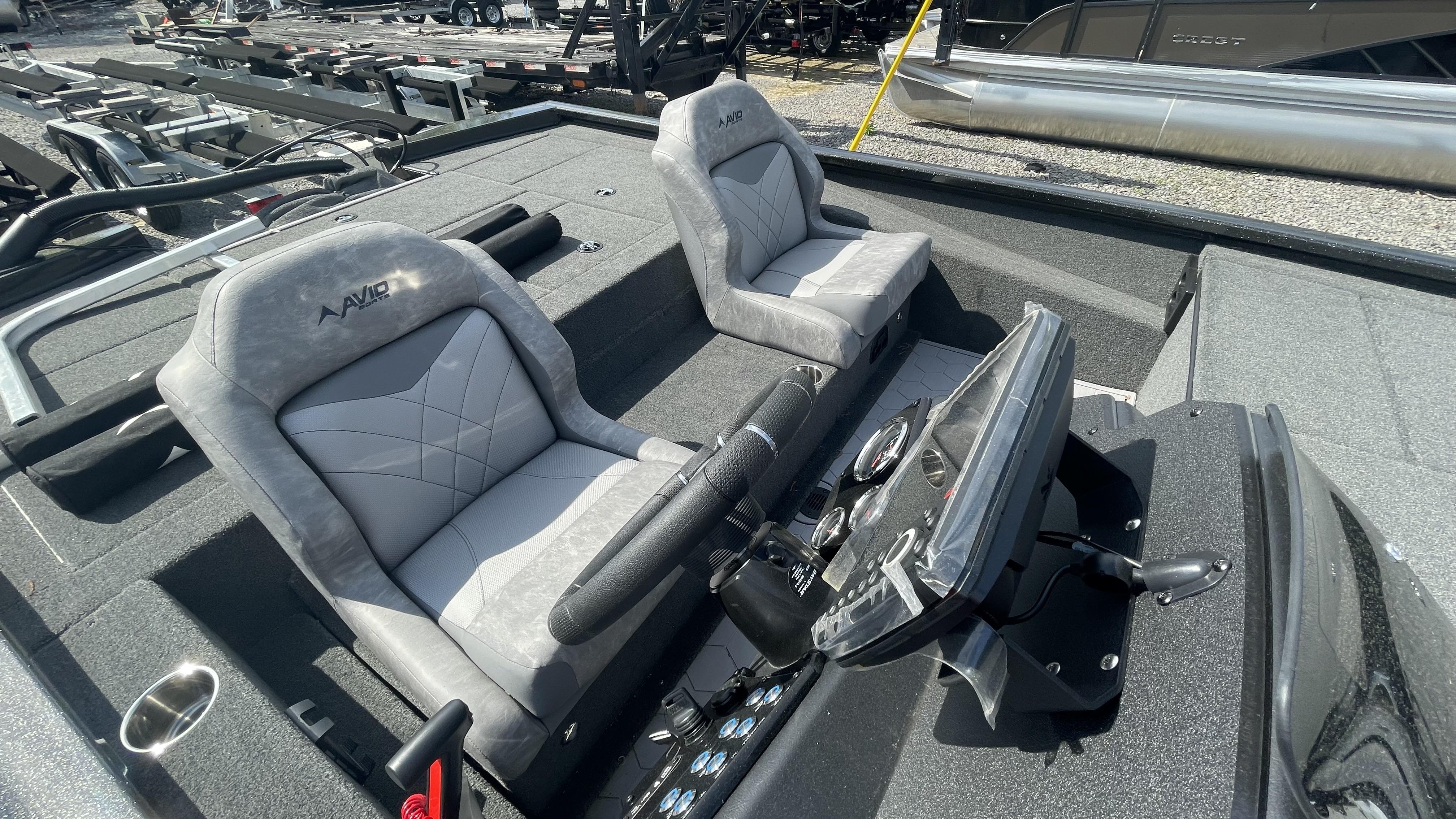 Slide: The Image of 2023 Avid 19XB boat interior with dual seats and steering console. - 6