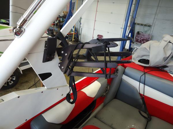 Slide: The Image of Wakeboard rack on a 2021 Axis A20 boat with red and gray interior. - 11
