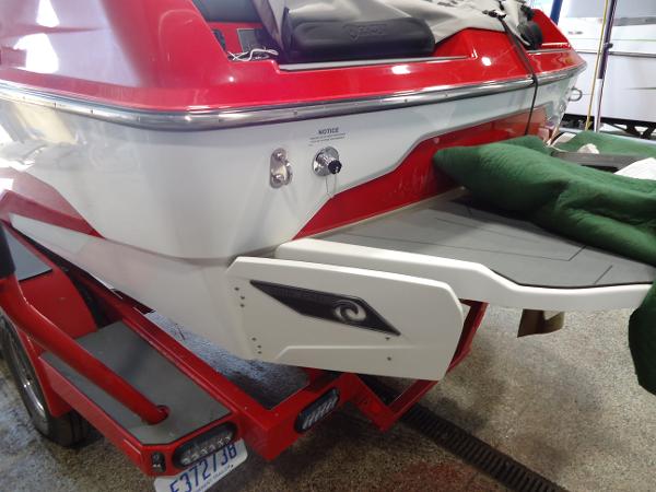 Slide: The Image of 2021 Axis A20 boat rear view on trailer in garage. - 15