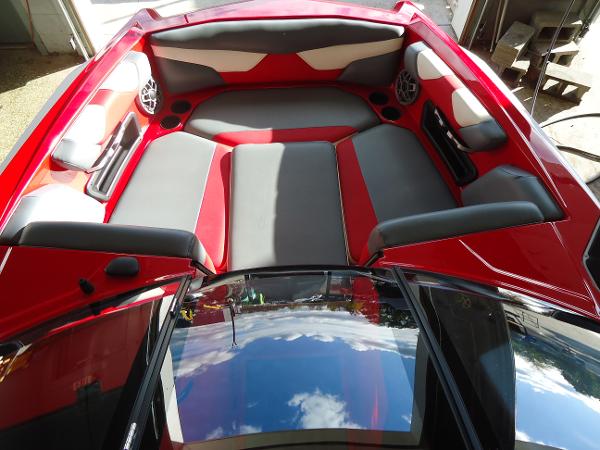 Slide: The Image of 2021 Axis A20 boat interior with red and gray seating. - 5