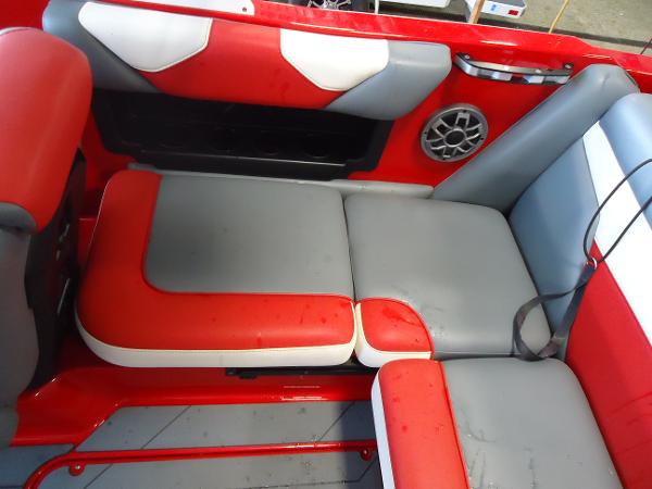 Slide: The Image of 2021 Axis A20 boat interior with red, gray, and white seating. - 8