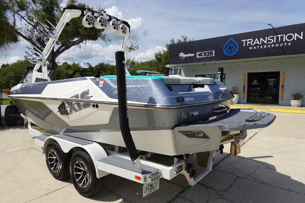 Slide: The Image of 2020 Axis T22 boat on trailer outside Transition Watersports store. - 7