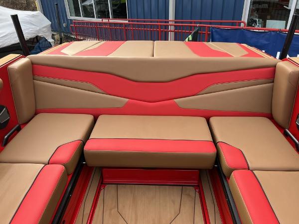 Slide: The Image of 2024 Axis T235 boat interior with red and tan seating. - 13