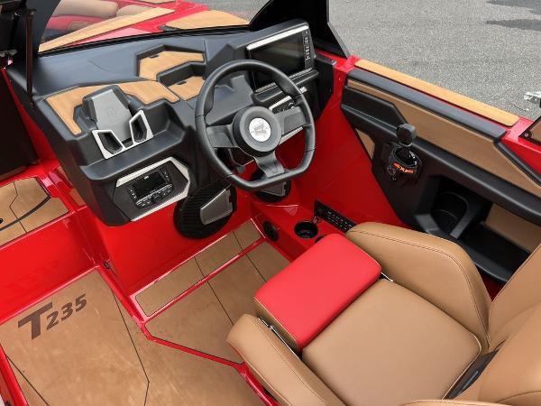Slide: The Image of 2024 Axis T235 boat interior with steering wheel and control panel. - 6