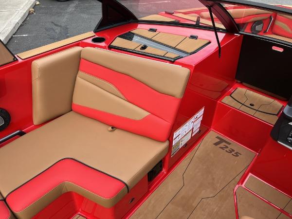 Slide: The Image of 2024 Axis T235 boat interior with red and tan seating. - 7