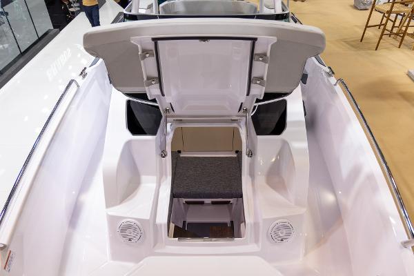 Slide: The Image of 2024 Axopar 29 Sun Top boat interior with open storage compartment. - 4