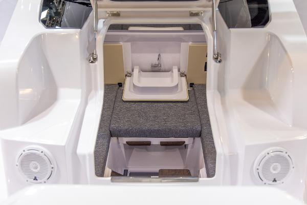 Slide: The Image of 2024 Axopar 29 Sun Top boat interior with seating and sink. - 5