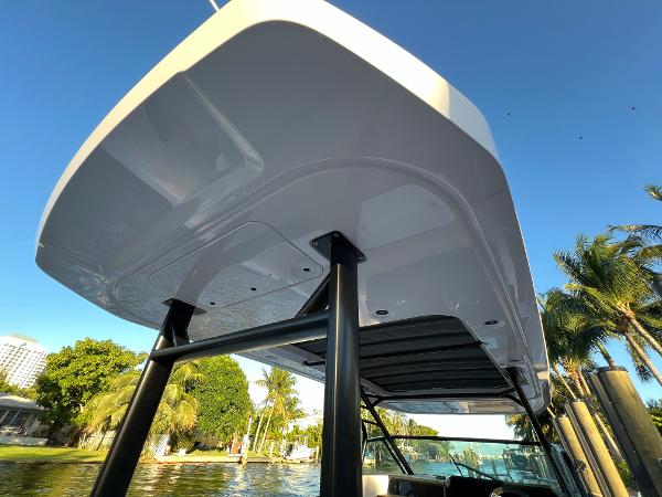 Slide: The Image of 2023 Axopar 37 Sun-Top boat with sleek design and sturdy structure. - 29