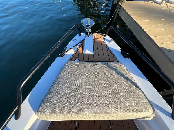 Slide: The Image of 2023 Axopar 37 Sun-Top bow with cushioned seating and teak decking. - 38