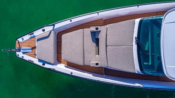 Slide: The Image of Top view of 2023 Axopar 37 Sun-Top boat with sunbathing area. - 4