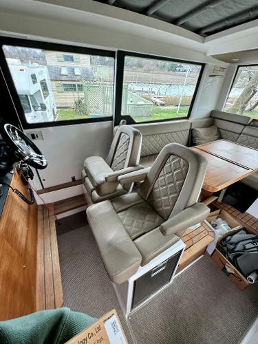 Slide: The Image of Interior of 2018 Axopar 37XC CROSS CABIN with leather seats and dining area. - 13