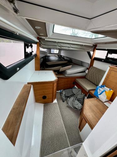 Slide: The Image of Interior of 2018 Axopar 37XC CROSS CABIN with seating and storage. - 17