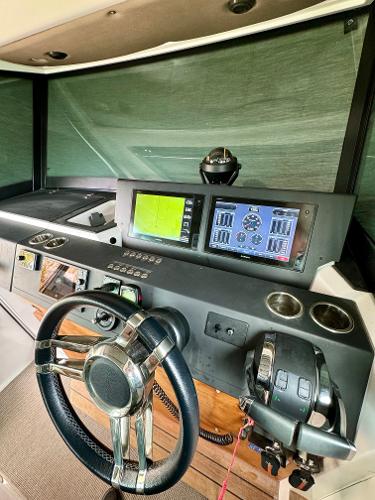 Slide: The Image of 2018 Axopar 37XC CROSS CABIN helm with modern navigation and control systems. - 18