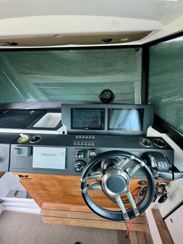 Slide: The Image of 2018 Axopar 37XC CROSS CABIN helm with modern navigation system and steering wheel. - 20
