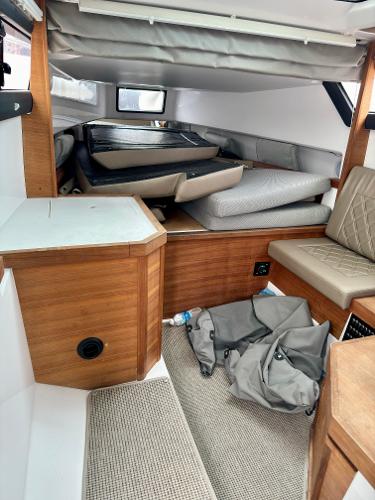 Slide: The Image of Interior cabin of 2018 Axopar 37XC CROSS CABIN with wooden finishes and seating. - 26