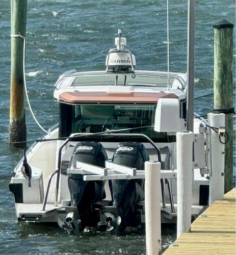 Slide: The Image of Axopar 37XC CROSS CABIN 2018 docked with twin outboard engines. - 8