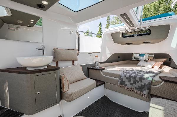 Slide: The Image of Luxurious interior of 2024 Axopar 37 XC Cross Cabin with wet bar. - 17