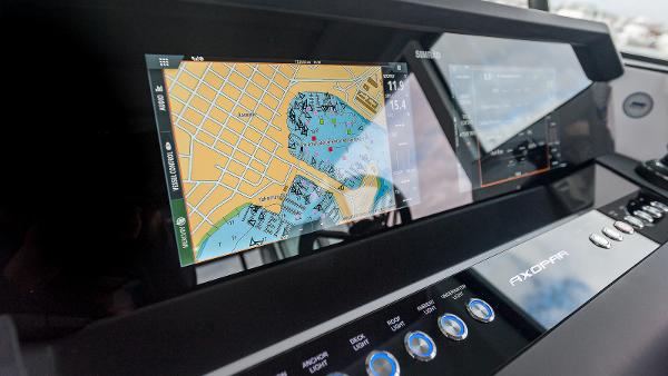 Slide: The Image of 2024 Axopar 37 XC Cross Cabin navigation display with map and controls. - 7