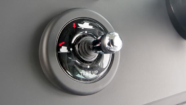 Slide: The Image of 2024 Axopar 37 XC Cross Cabin trim tab control knob. - 8